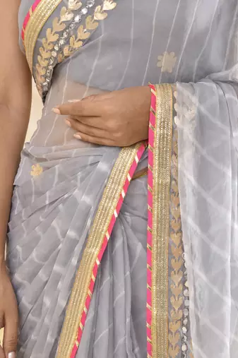 Grey leheriya worked saree with unstitched blouse fabric