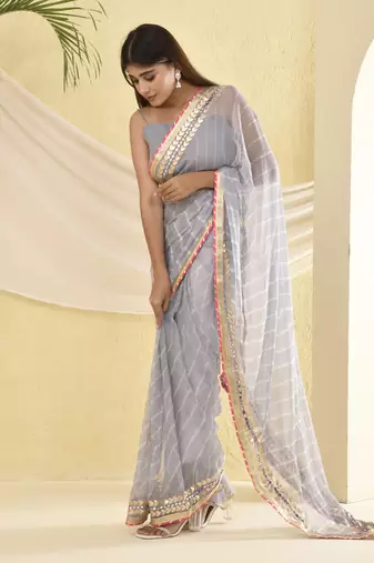 Grey leheriya worked saree with unstitched blouse fabric
