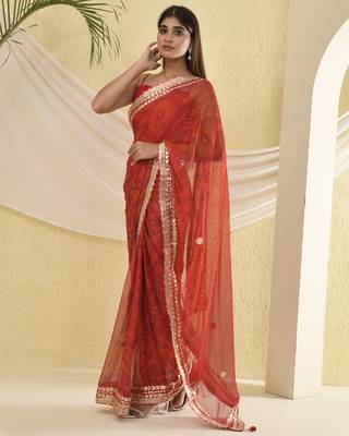 Red bandhani worked saree with unstitched blouse fabric 1