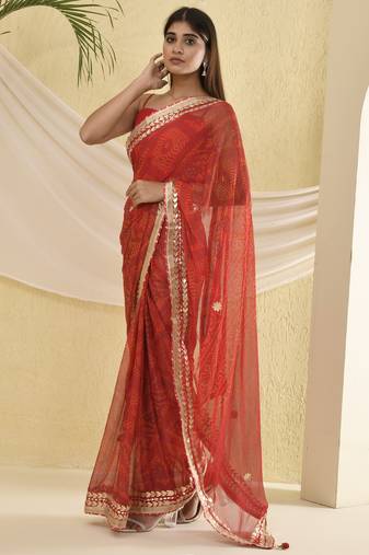 Red bandhani worked saree with unstitched blouse fabric