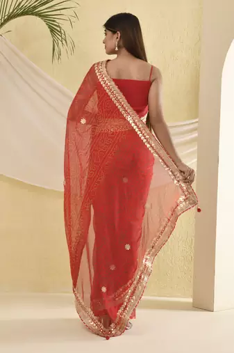 Red bandhani worked saree with unstitched blouse fabric