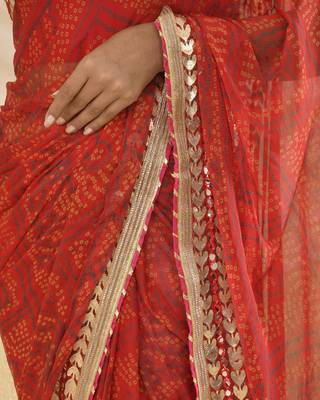 Red bandhani worked saree with unstitched blouse fabric 4