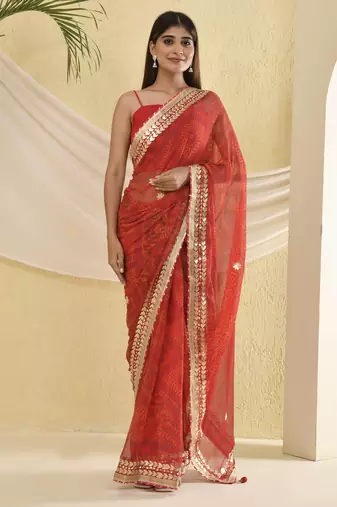 Red bandhani worked saree with unstitched blouse fabric