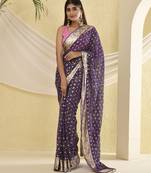 Purple bandhani and zari work saree with unstitched pink blouse fabric