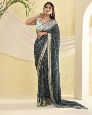 Blue heavy bordered saree with unstitched blouse fabric 1
