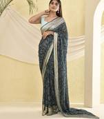Blue heavy bordered saree with unstitched blouse fabric