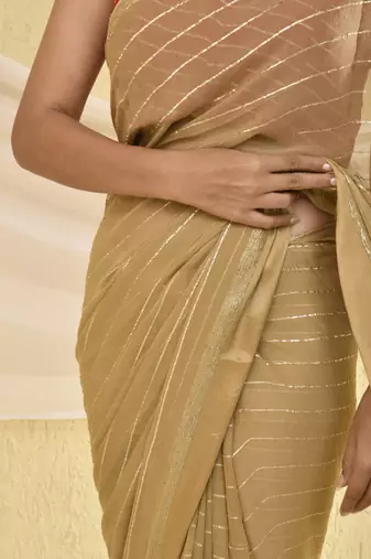 Golden zari striped bordered saree with unstitched blouse fabric