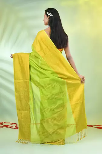 Light green cotton saree with zari borders