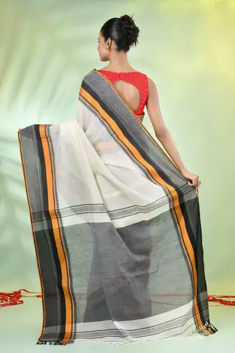 Off white cotton saree with temple borders