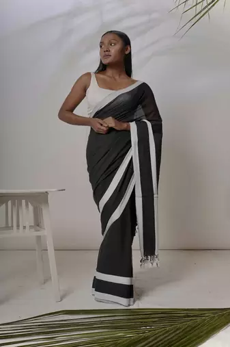 Black solid pure cotton saree with white border without blouse