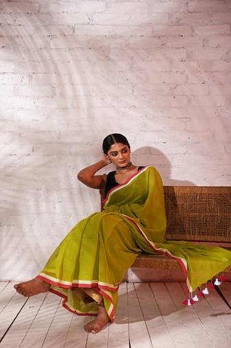 Light green cotton saree with pink and white border Without blouse