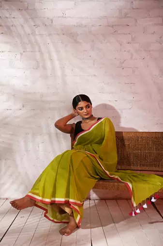 Light green cotton saree with pink and white border Without blouse