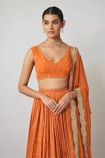 Saffron orange sequin and thread embroidered georgette lehenga set