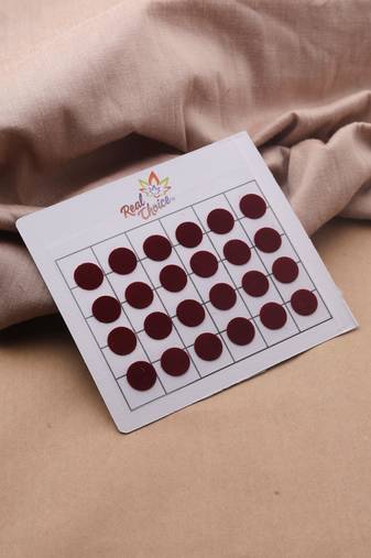 Big round maroon bindi leaflet