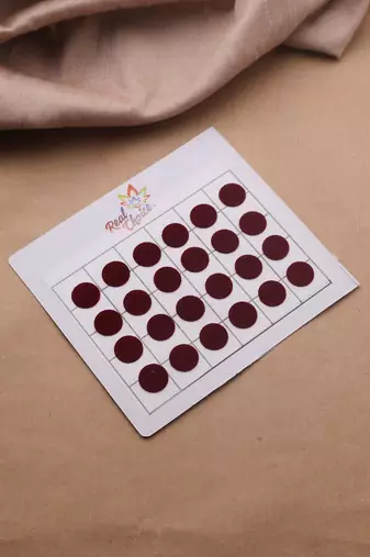 Big round maroon bindi leaflet