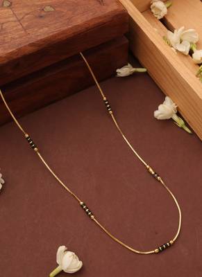 Simple gold line mangalsutra with black beads 1