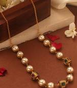 Pearl necklace with stone-studded gold balls