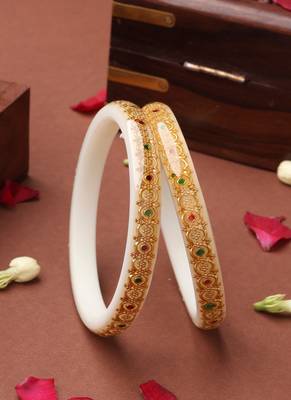 White bangles with gold embellishments and floral designs 1