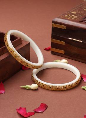 White bangles with gold embellishments and floral designs 2