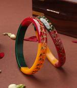 Multicolored bangles with gold embellishments and floral designs