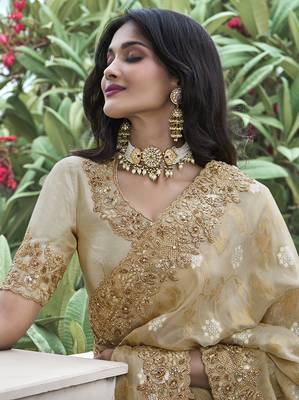 Cream embroidered silk blend saree 2