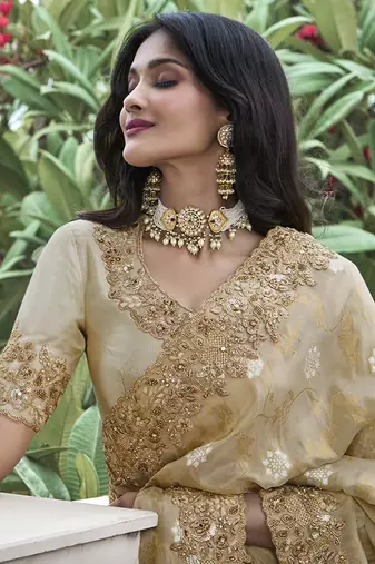 Cream embroidered silk blend saree