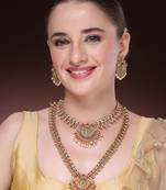 Women's set of 2 gold-plated green & pink stone studded peacock design temple jewellery set