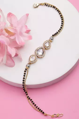 Women gold-plated & black brass ad-studded hand mangalsutra link bracelet
