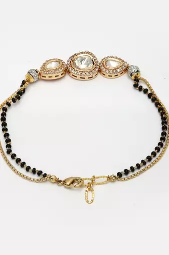 Women gold-plated & black brass ad-studded hand mangalsutra link bracelet