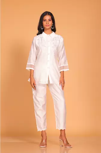 White coset hand embroidery