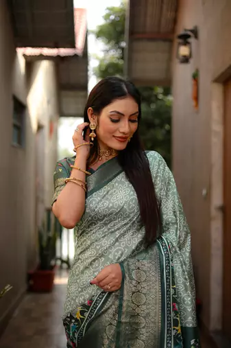 Pista dola silk blend Woven border saree with digital kalamkari and bandhej print