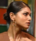 Gold and green stimulating earring