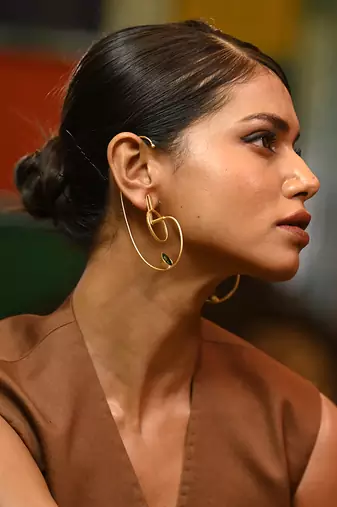 Gold and green stimulating earring