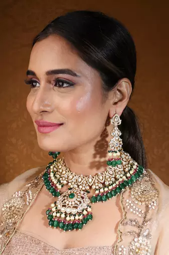 Bridal choker with kundan and american stones featuring green drops