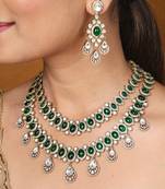 Two-layer necklace set with green stones and american stones, earrings & maang tikka