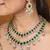 Two-layer necklace set with green stones and american stones, earrings & maang tikka