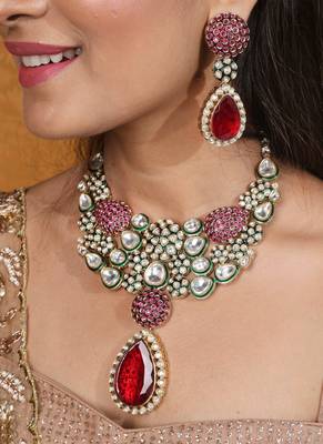 Jaipur jadau work necklace set with red stones, earrings, and maang tikka in kundan 1