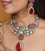 Jaipur jadau work necklace set with red stones, earrings, and maang tikka in kundan