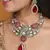 Jaipur jadau work necklace set with red stones, earrings, and maang tikka in kundan