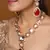 Kundan stone necklace set with red stone pendant
