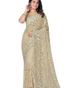 Beige embroidered net saree with blouse