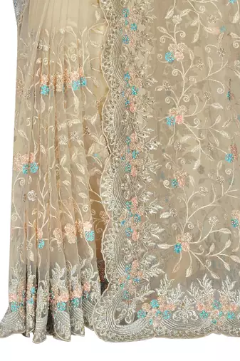 Beige embroidered net saree with blouse