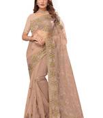 Beige embroidered net saree with blouse