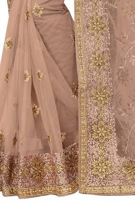 Beige embroidered net saree with blouse 3