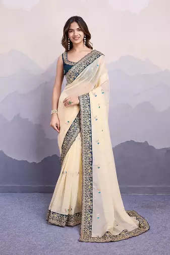 cream embroidered georgette saree with blouse