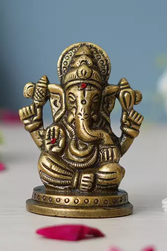 One metal handcrafted golden blessing lord ganesha idol