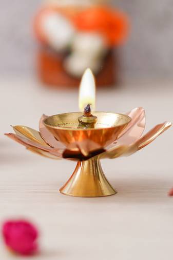 One copper and golden lotus flower shape decorative brass diya