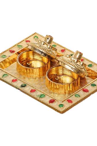 One golden decorative roli chawal holder, akshata haldi kumkum holder