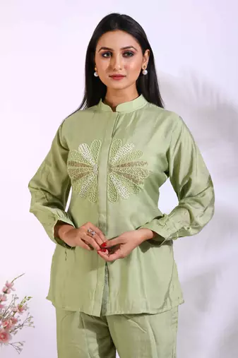Green corset with hand embroidery