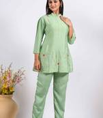 Green corset with hand embroidery